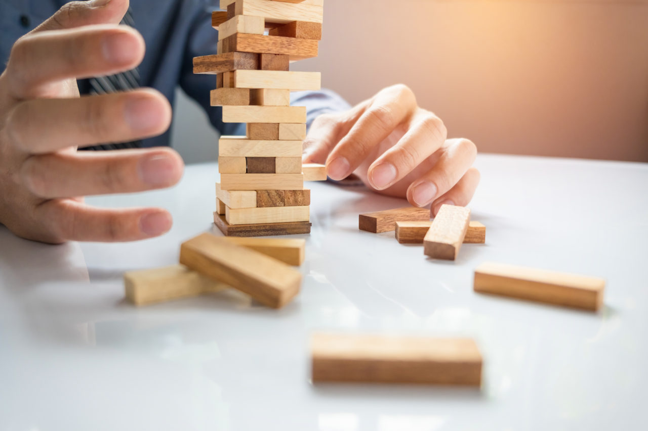 https://www.louisdavidbenyayer.com/wp-content/uploads/2020/10/planning-risk-and-strategy-in-business-businessman-gambling-placing-wooden-block-on-a-tower-1280x853.jpg