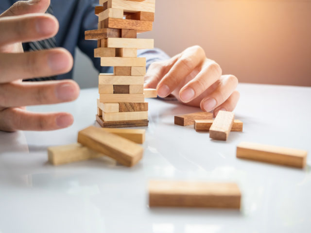 https://www.louisdavidbenyayer.com/wp-content/uploads/2020/10/planning-risk-and-strategy-in-business-businessman-gambling-placing-wooden-block-on-a-tower-640x480.jpg